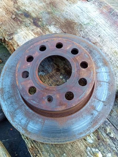 A brake disc that has weird streaks and rust pockets on the working surface but no real wear rim.