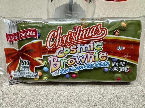 A pack of Little Debbie Cosmic Brownies with green frosting for Christmas.