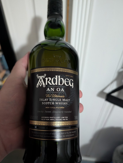 bottle of Ardbeg An Oa scotch
Islay Single Malt Scotch Whisky
green bottle with black label, white printing, gold border