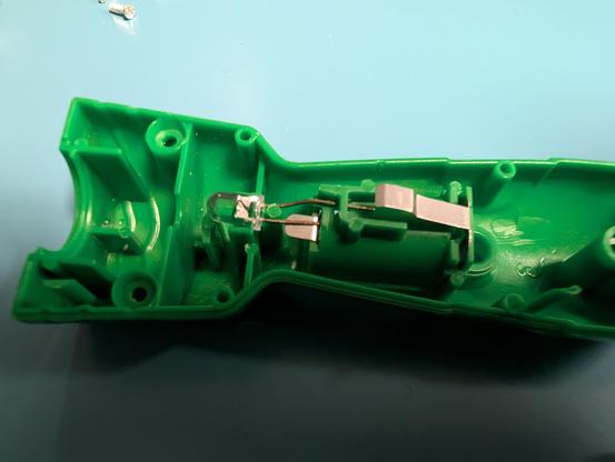 Inside of a flashlight type toy showing a 5mm LED directly connected to the battery compartment